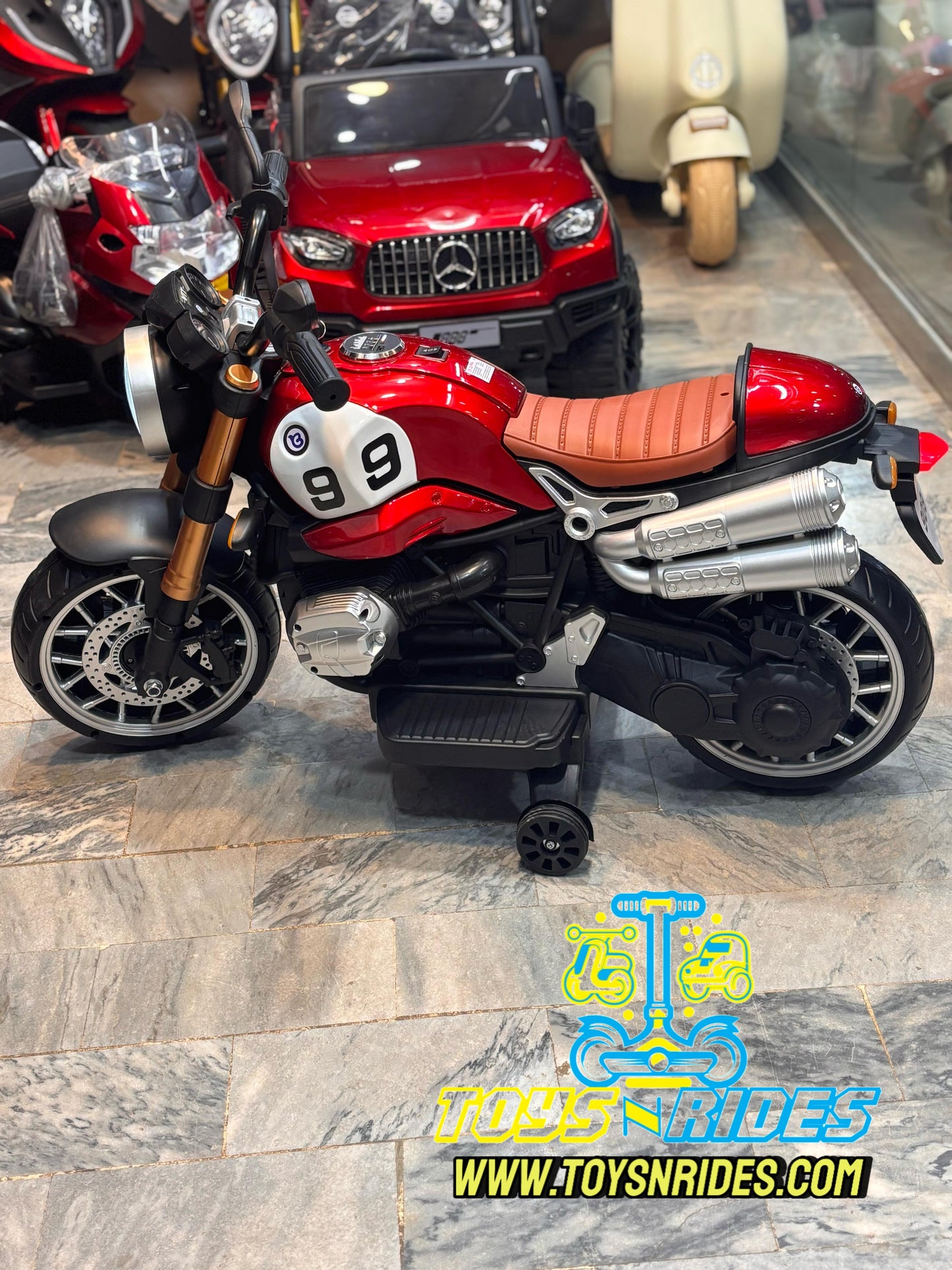 Parent adjusting speed settings on kids' battery-powered Harley bike
