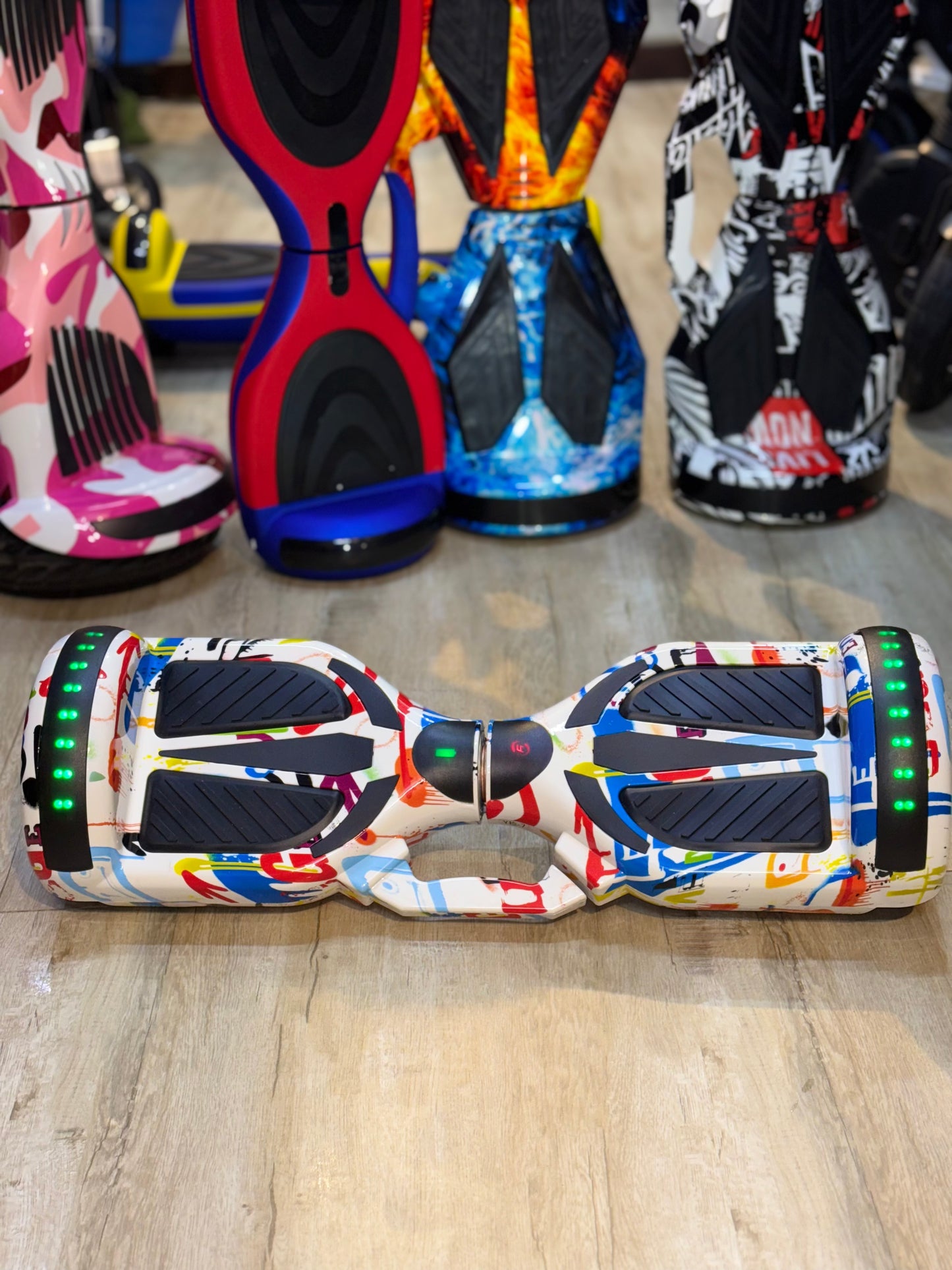 Close-up of the TOYSNRIDES hoverboard's Bluetooth speaker and LED light features.