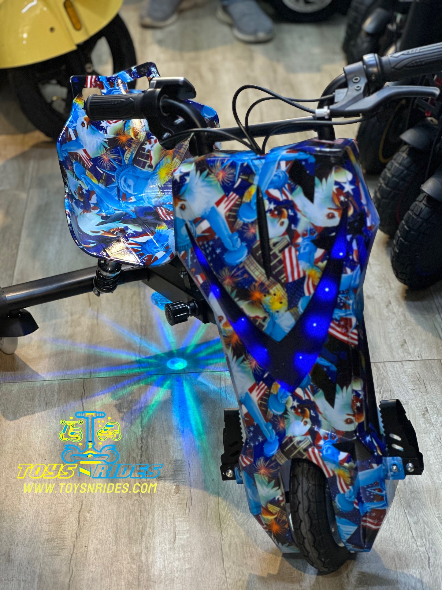 Child riding a red drift bike for kids by TOYSNRIDES