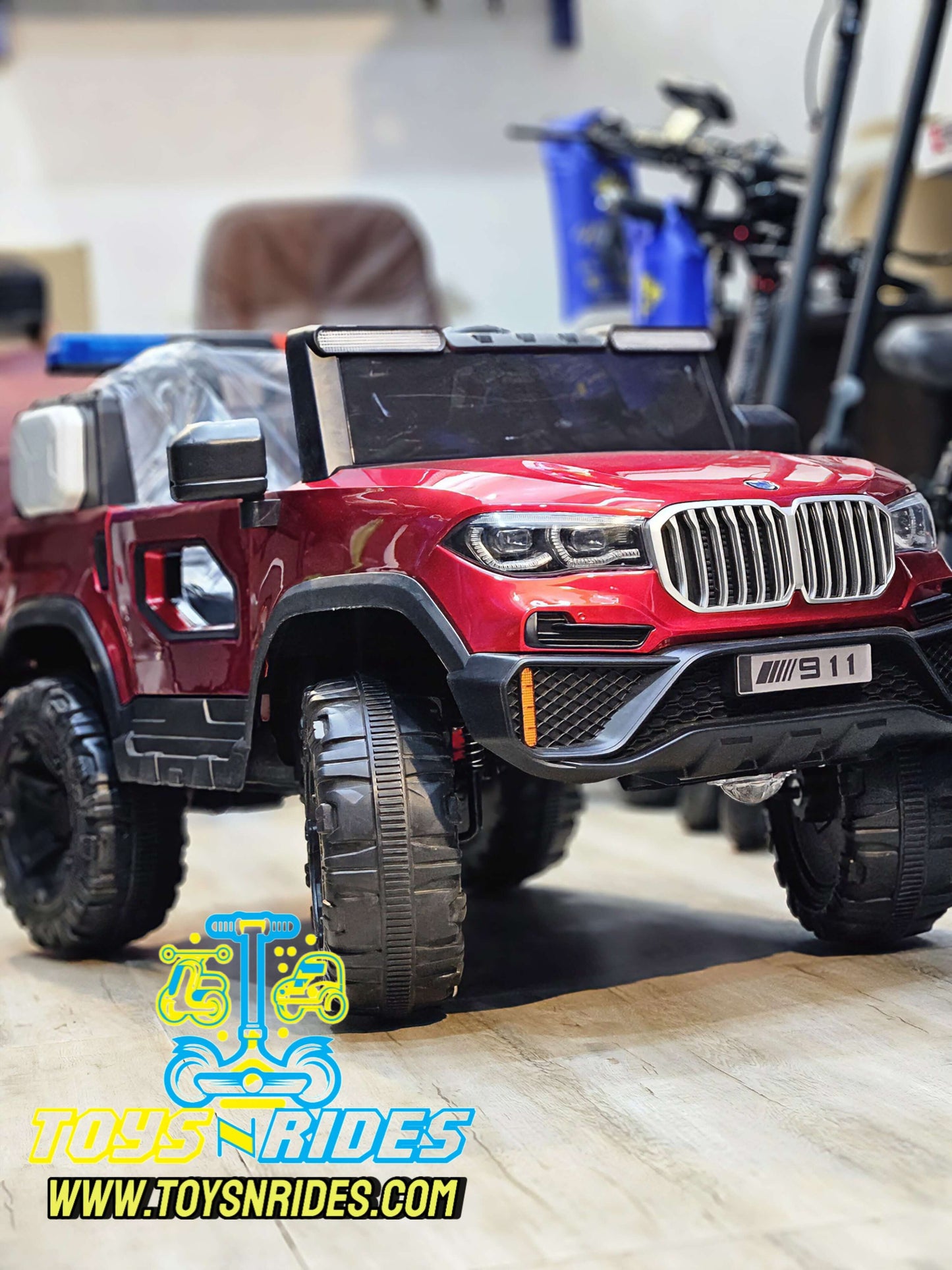 Kids driving a premium 4x4 battery-operated BMW toy car