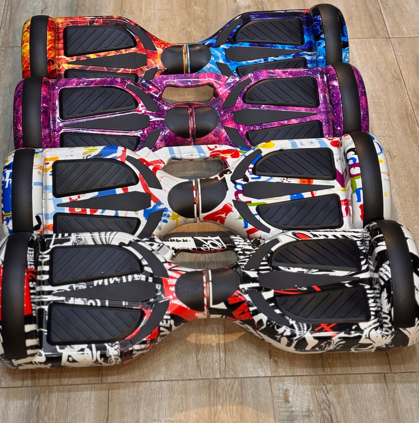Stylish TOYSNRIDES hoverboard in multiple colors, perfect for gifting.