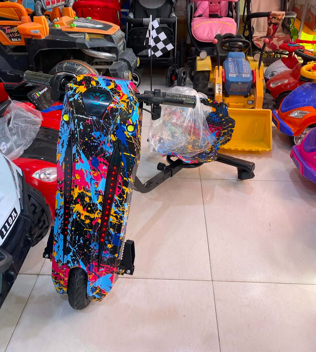 Kids 3-Wheel 360 Electric Drift Scooter by TOYSNRIDES with Bluetooth, LED wheel lights, shock absorbers, and adjustable length. Perfect for outdoor fun and drifting adventures!