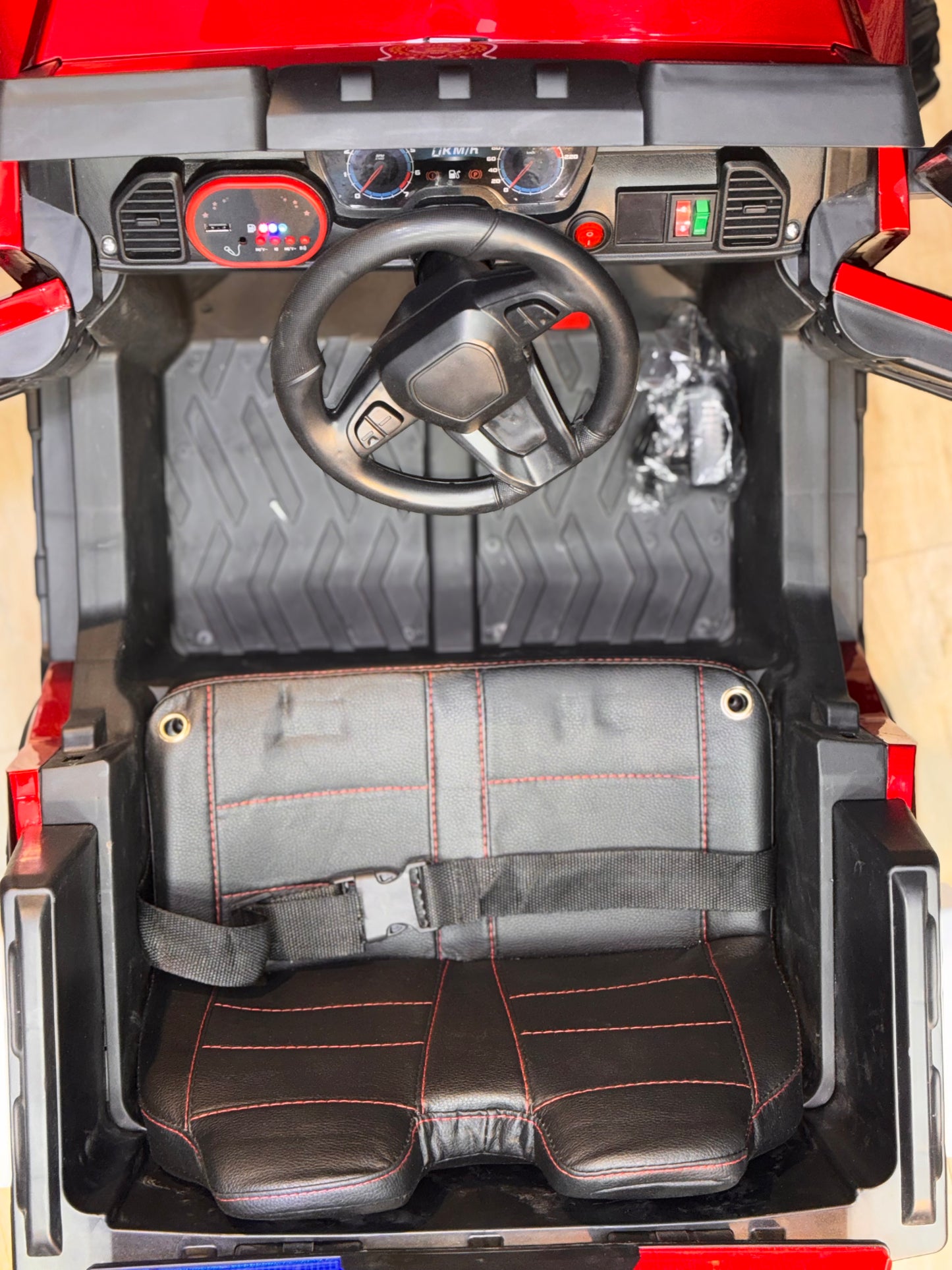 BMW-shaped 4WD battery jeep for kids on rough terrain