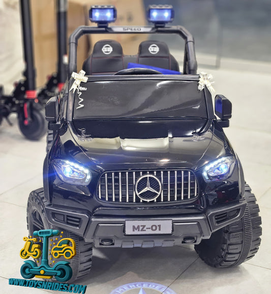 Toy car with Mercedes-Benz logo on a reflective surface