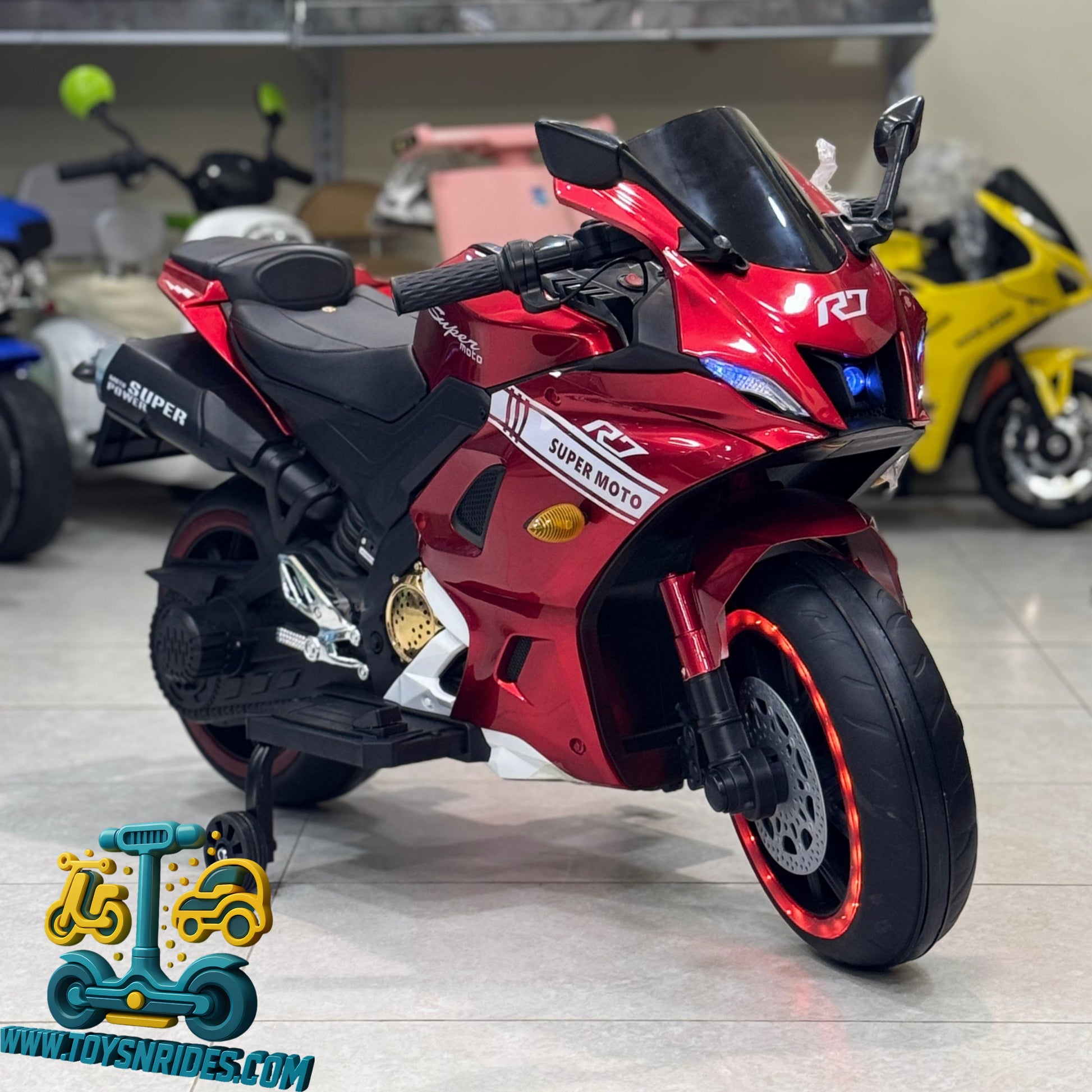 Red toy motorcycle with black accents on a gray floor, brand 'Super Moto' visible
