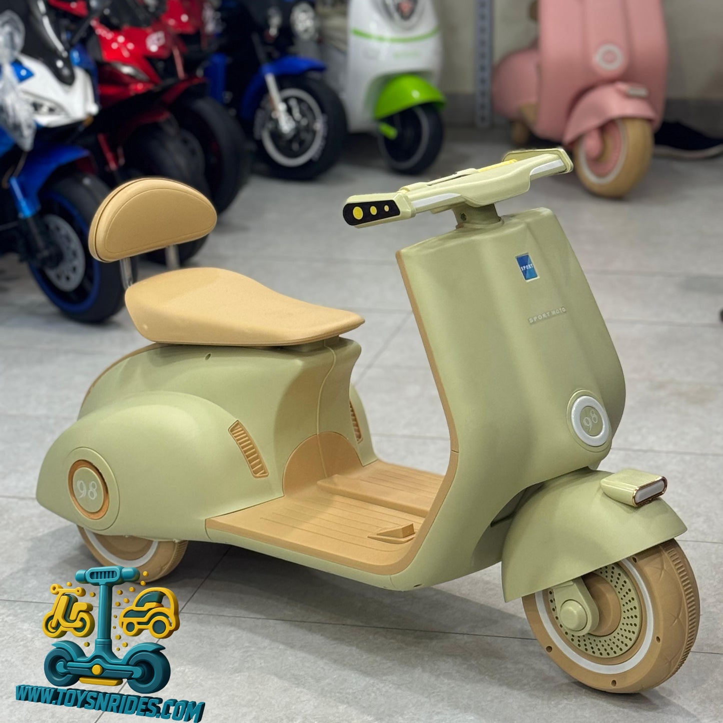 Children's toy scooter with a beige seat and green body, displayed indoors.