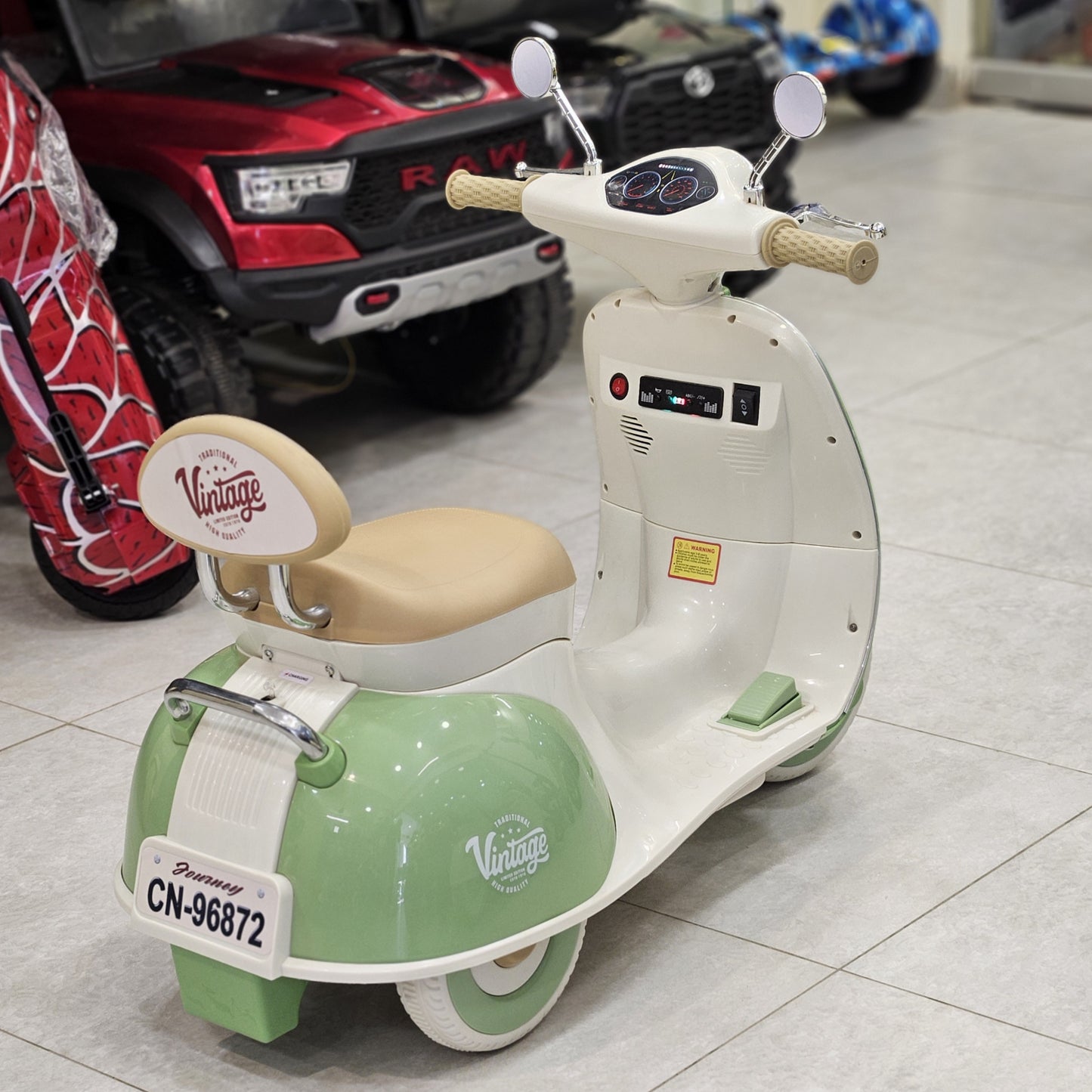Children's toy scooter with vintage design on a tiled floor