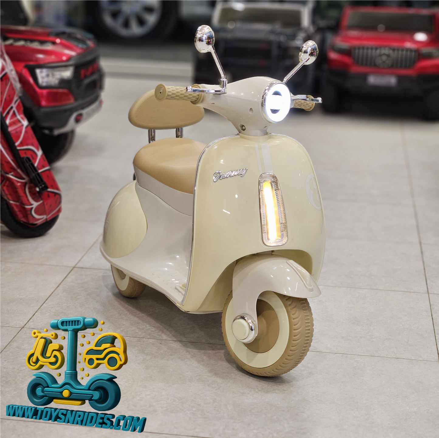 Children's toy scooter with a vintage design in a showroom setting.