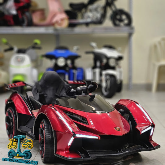 Red toy car with black accents on a blurred background of other toys
