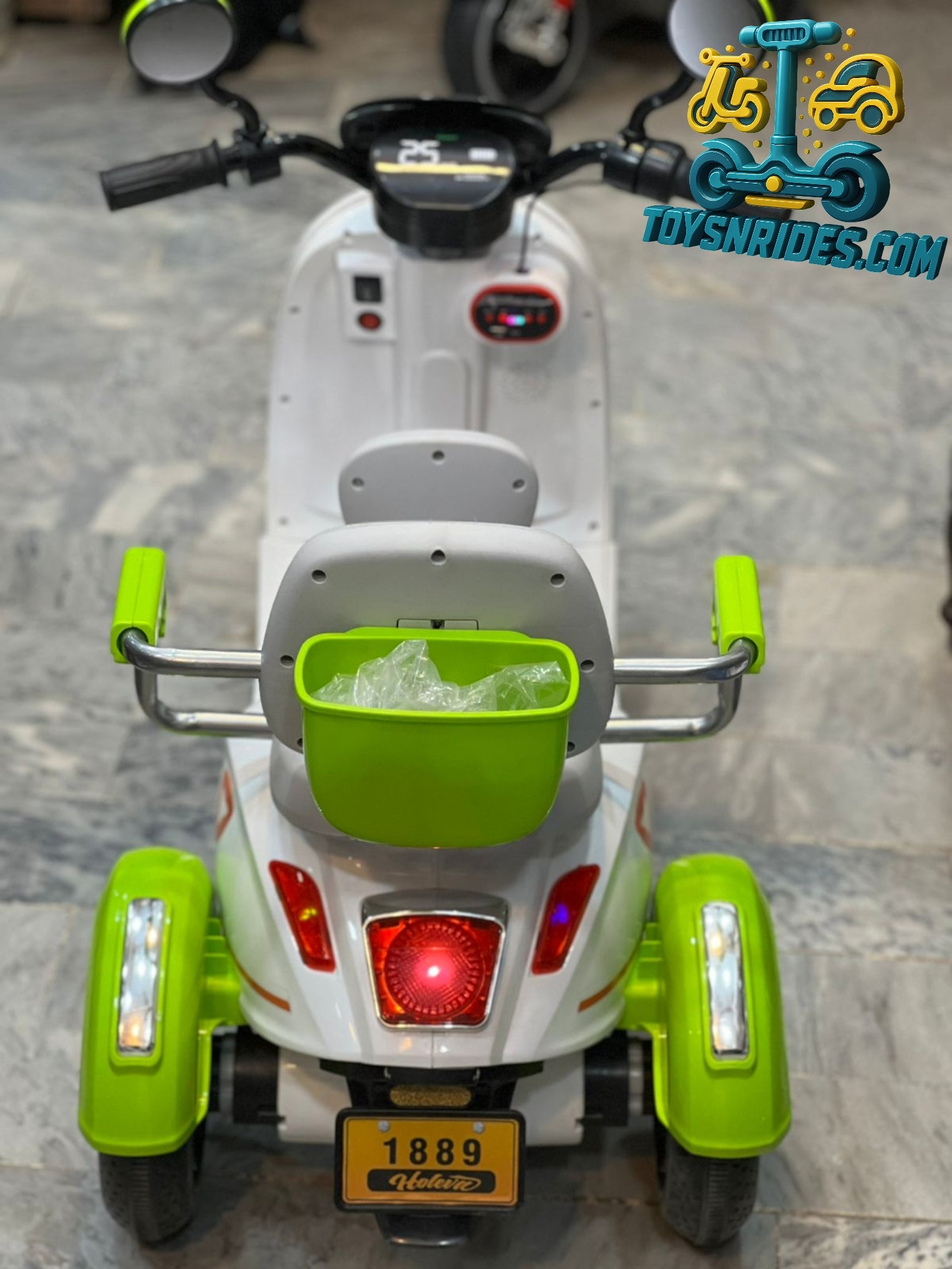 Children's toy scooter with green accents