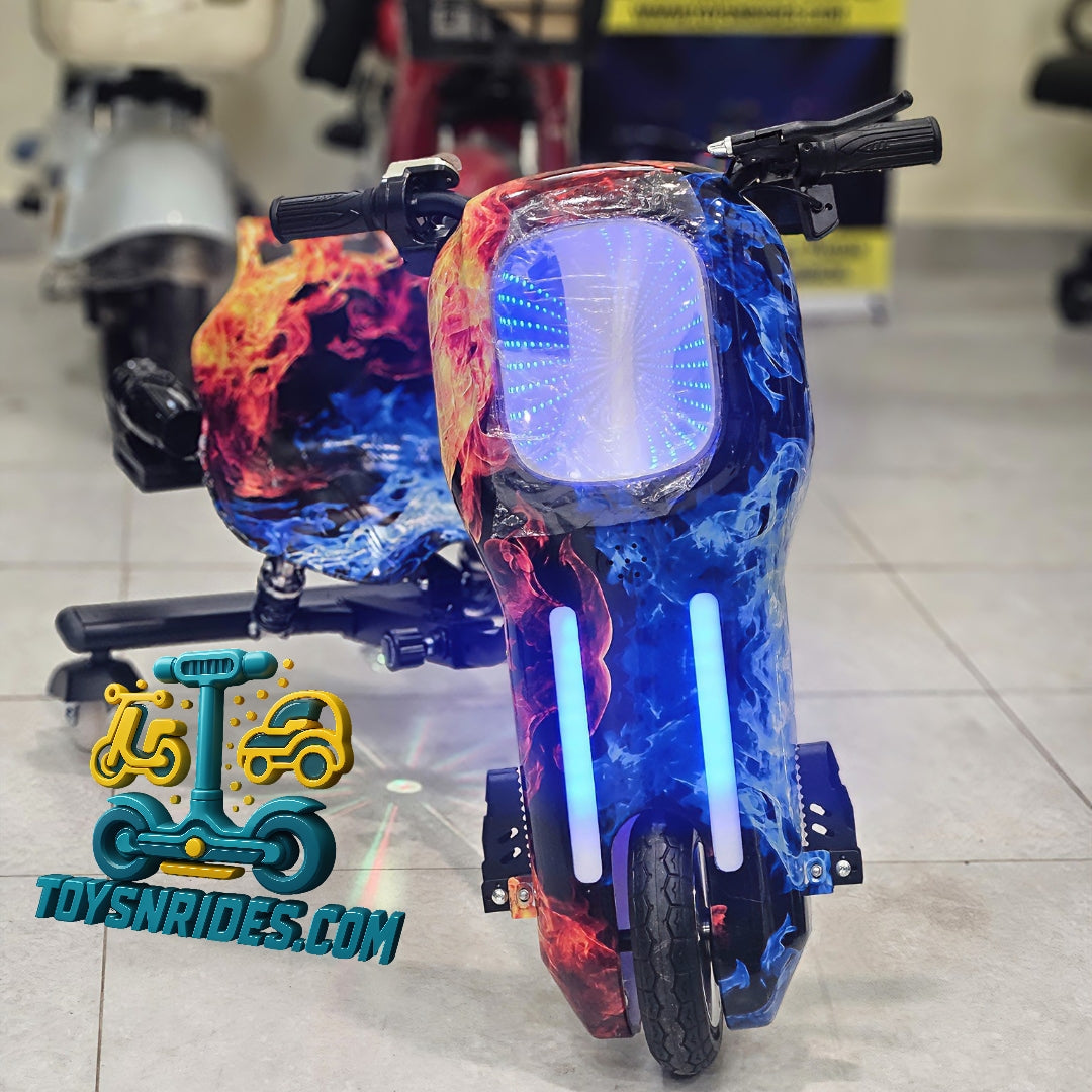 Colorful scooter with flame design on a tiled floor, brand 'ToysNrides.com' visible.