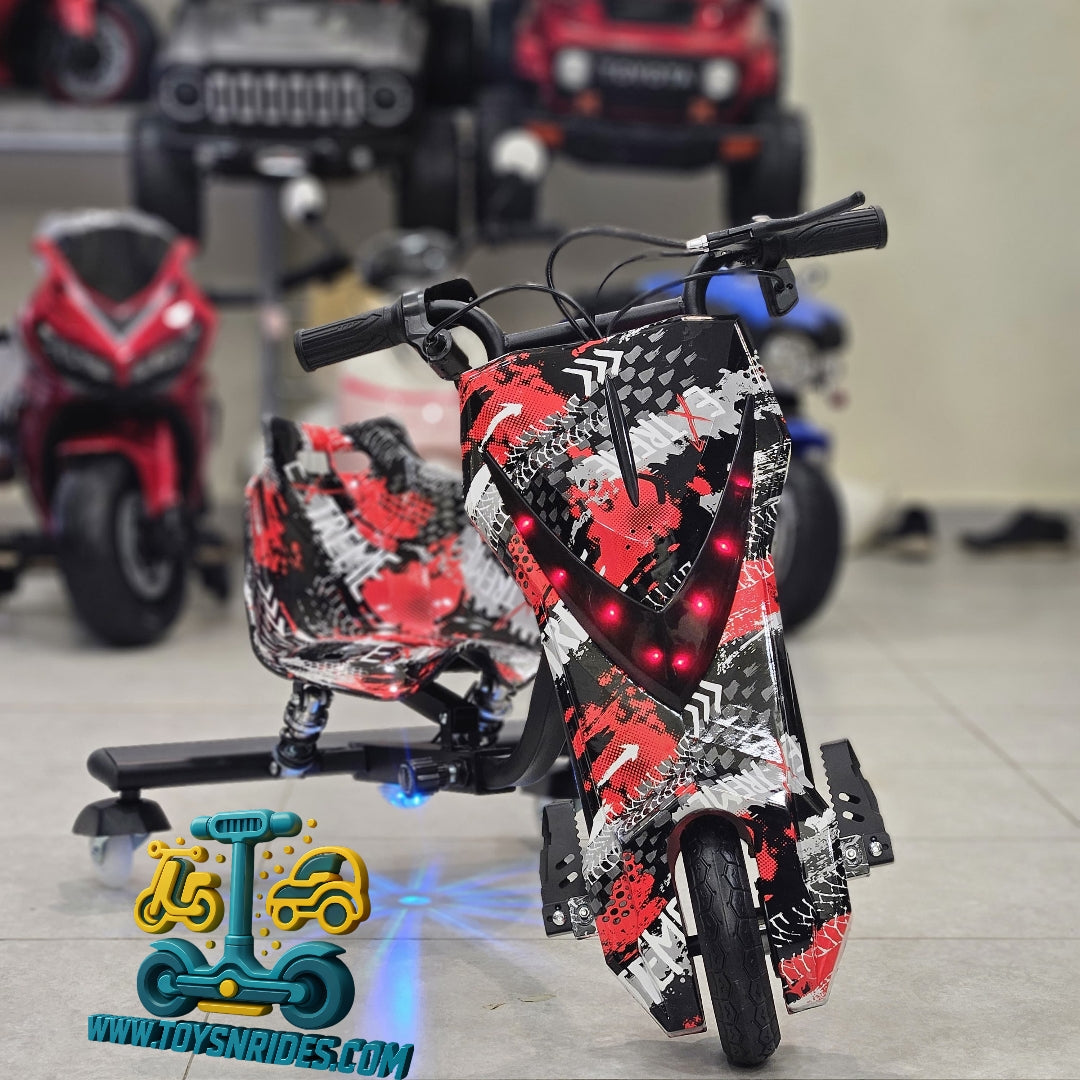 Children's toy scooter with red and black design in a showroom setting.