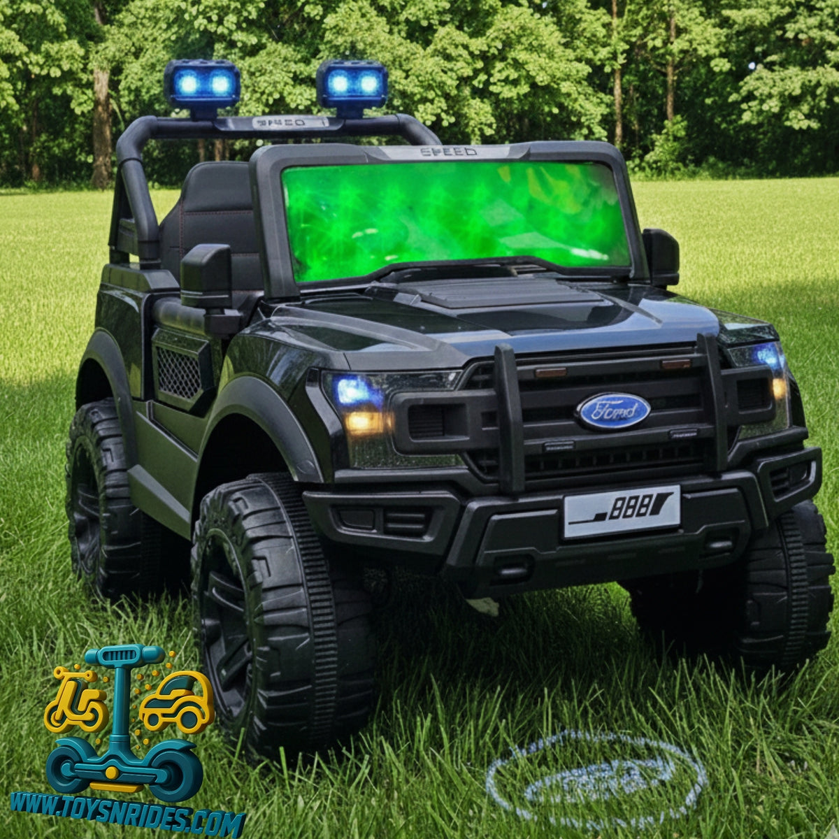 Toy truck with green screen and lights on grass, brand logo visible