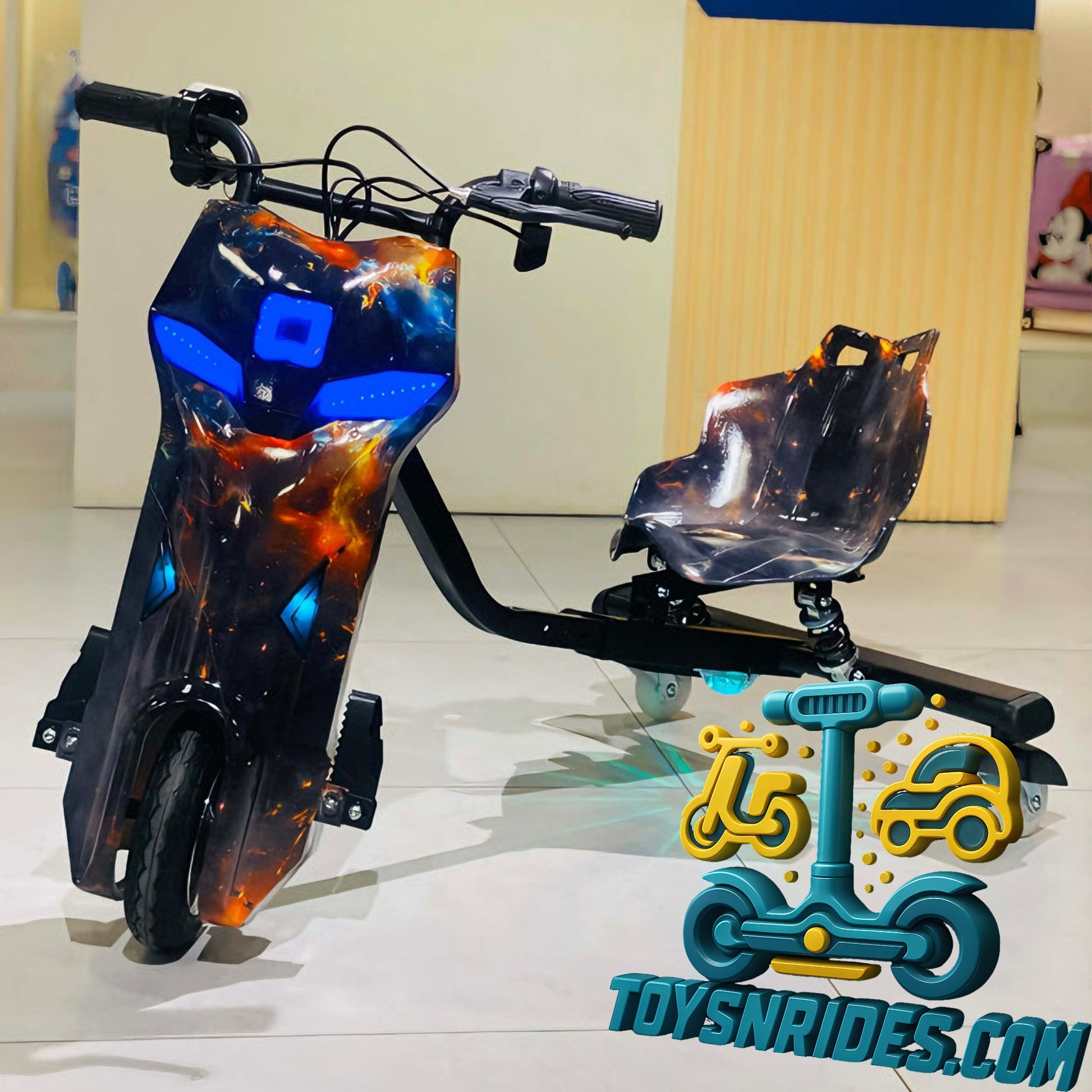 Children's toy scooter with flame-like design on a reflective surface, brand 'TOY SN RIDES' visible.