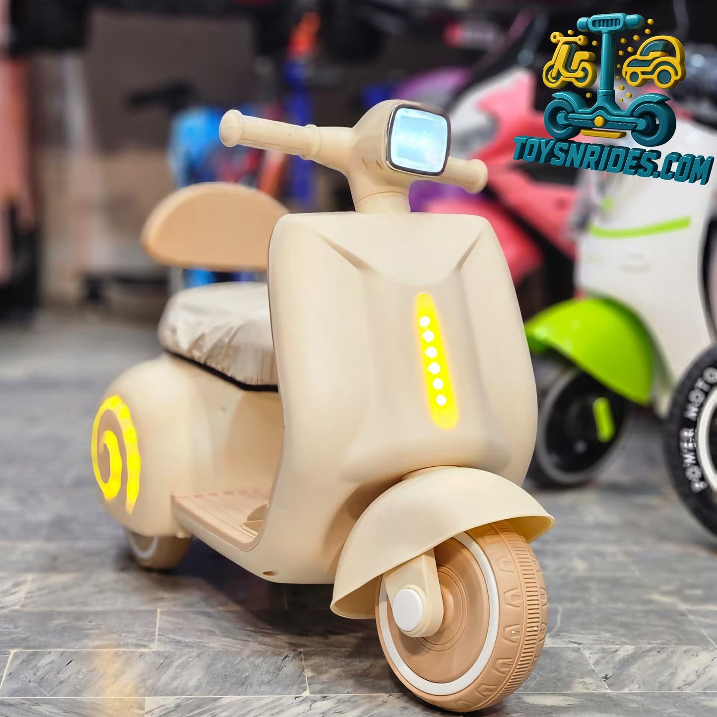 kids vespa bike in beige color