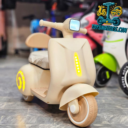 kids vespa bike in beige color